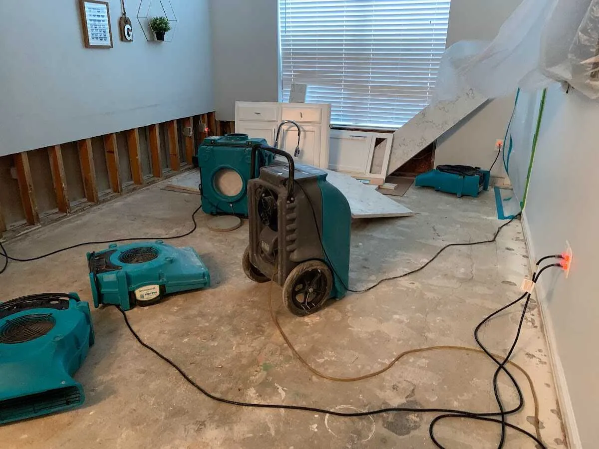 Dehumidifier in flood-cut room for Water Damage Restoration in Pasco